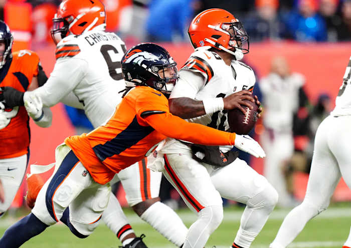 Nov 26, 2023; Denver, Colorado, USA; Denver Broncos safety P.J. Locke (6) sacks Cleveland Browns quarterback PJ Walker (10) in the fourth quarter at Empower Field at Mile High. Mandatory Credit: Ron Chenoy-USA TODAY Sports